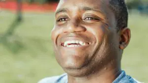 Photo by Kindel Media: https://www.pexels.com/photo/close-up-photo-of-smiling-man-7298460/ African American man smiling 