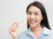 woman with Invisalign aligner orthodontic concept