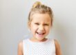 https://www.freepik.com/free-photo/joy-postive-emotions-happy-childhood-concept-beautiful-adorable-baby-girl-exclaiming-excitedly-being-overjoyed-because-she-is-going-amusement-park-cinema-shopping-laughing-out-loud_11890583.htm child smiling